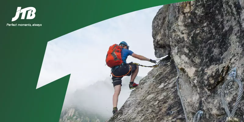 The banner image of the blog on the topic of meeting management where a man is climbing the rock showing overcoming the challenges